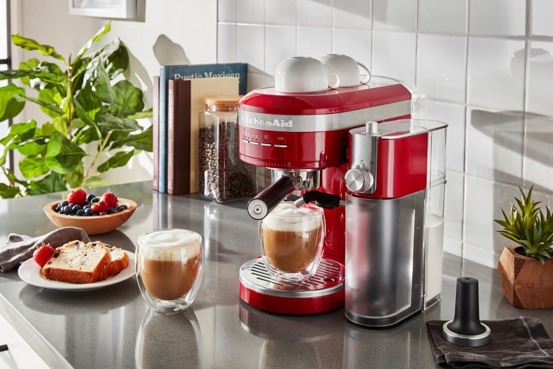 A KitchenAid® Semi-Automatic Espresso Machine with Automatic Milk Frother Attachment in Empire Red.
