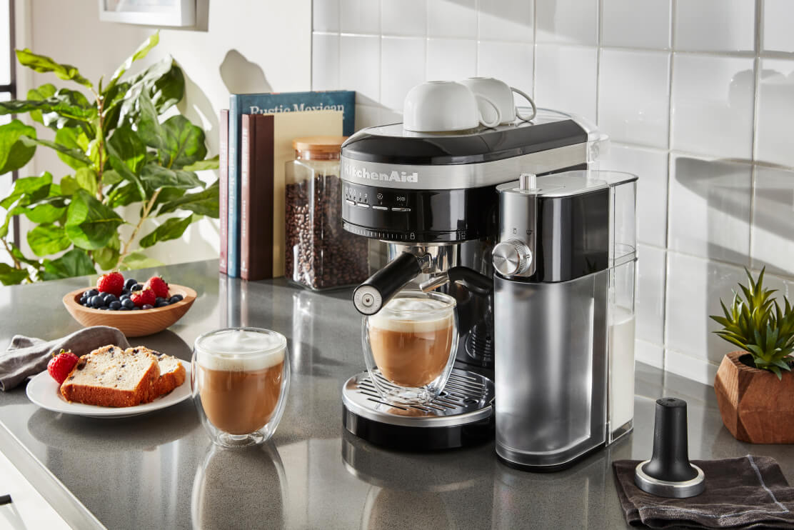 A KitchenAid® Semi-Automatic Espresso Machine with Automatic Milk Frother Attachment in Black.