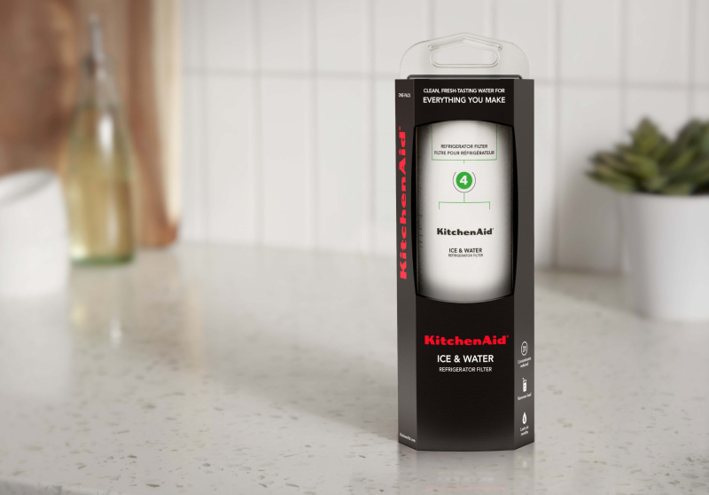 A KitchenAid® water filter on a countertop.