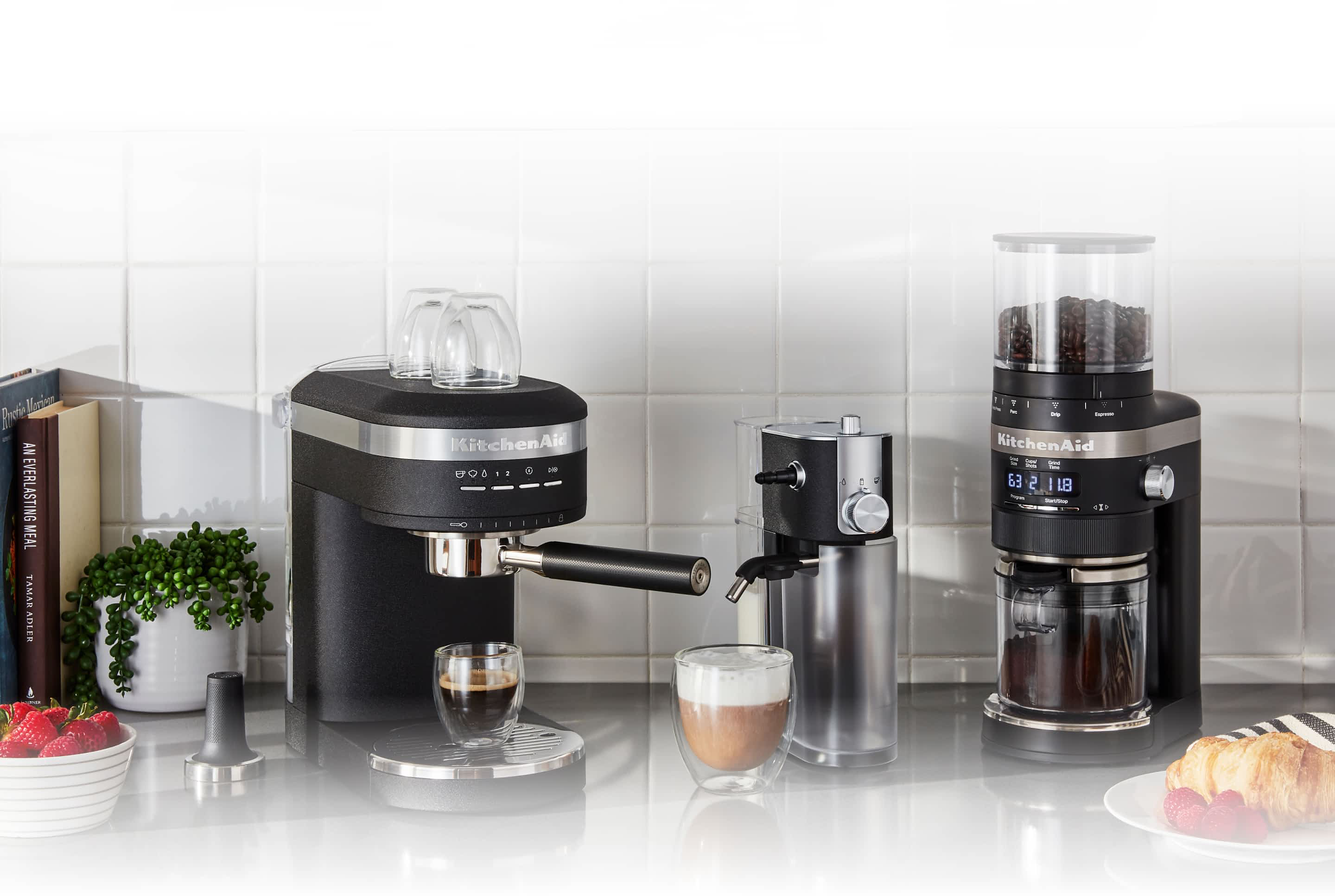 A KitchenAid® Automatic Espresso Machine, Milk Frother Attachment and Burr Grinder sitting on a countertop