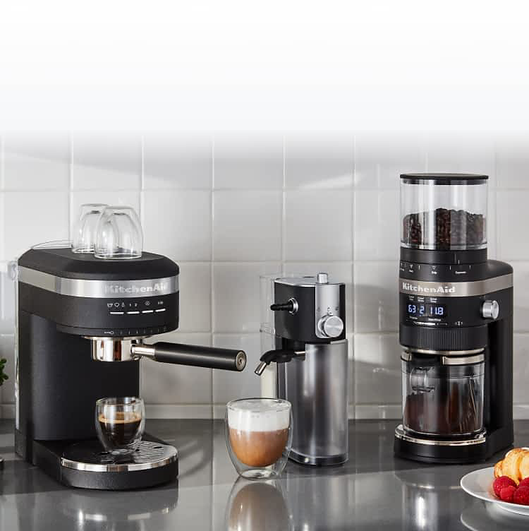 A KitchenAid® Automatic Espresso Machine, Milk Frother Attachment and Burr Grinder sitting on a countertop