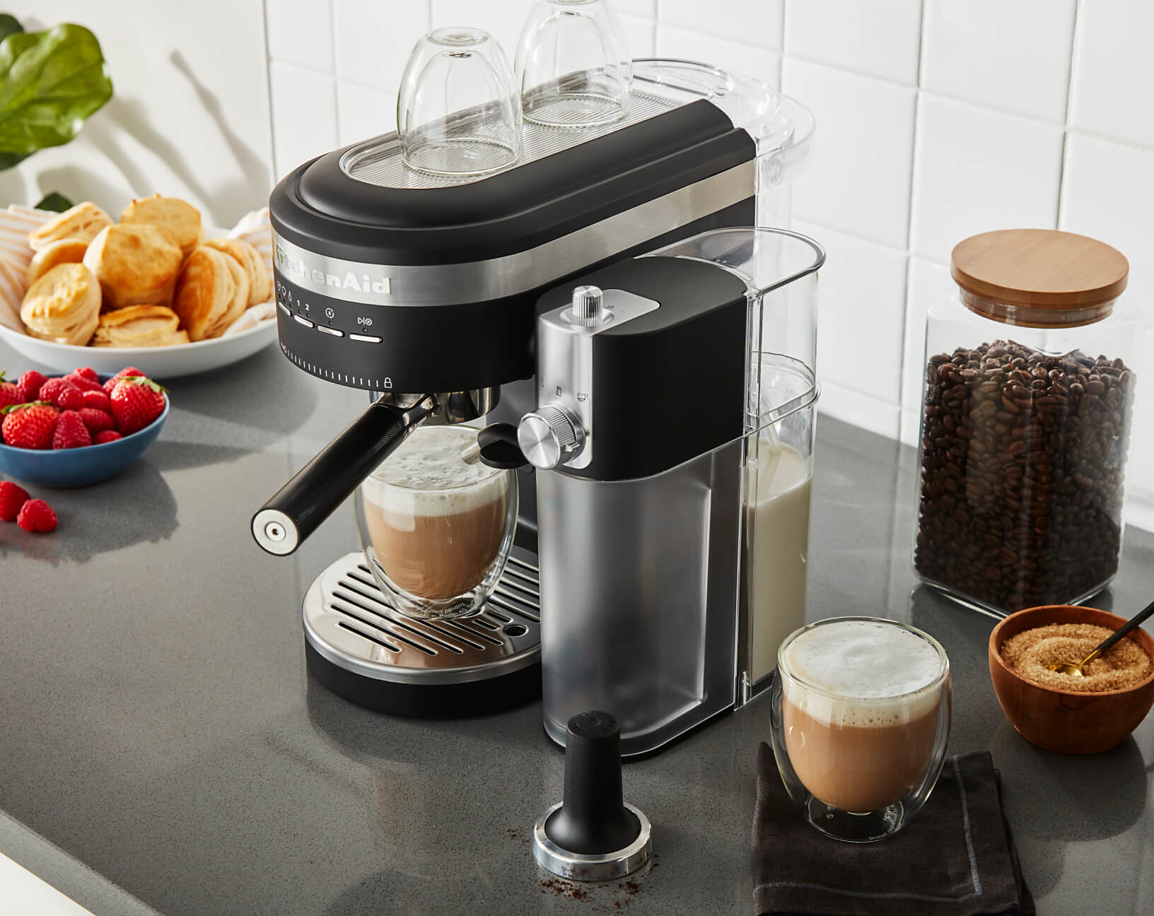 A Matte Black Semi-Automatic Espresso Machine and Automatic Milk Frother Attachment.