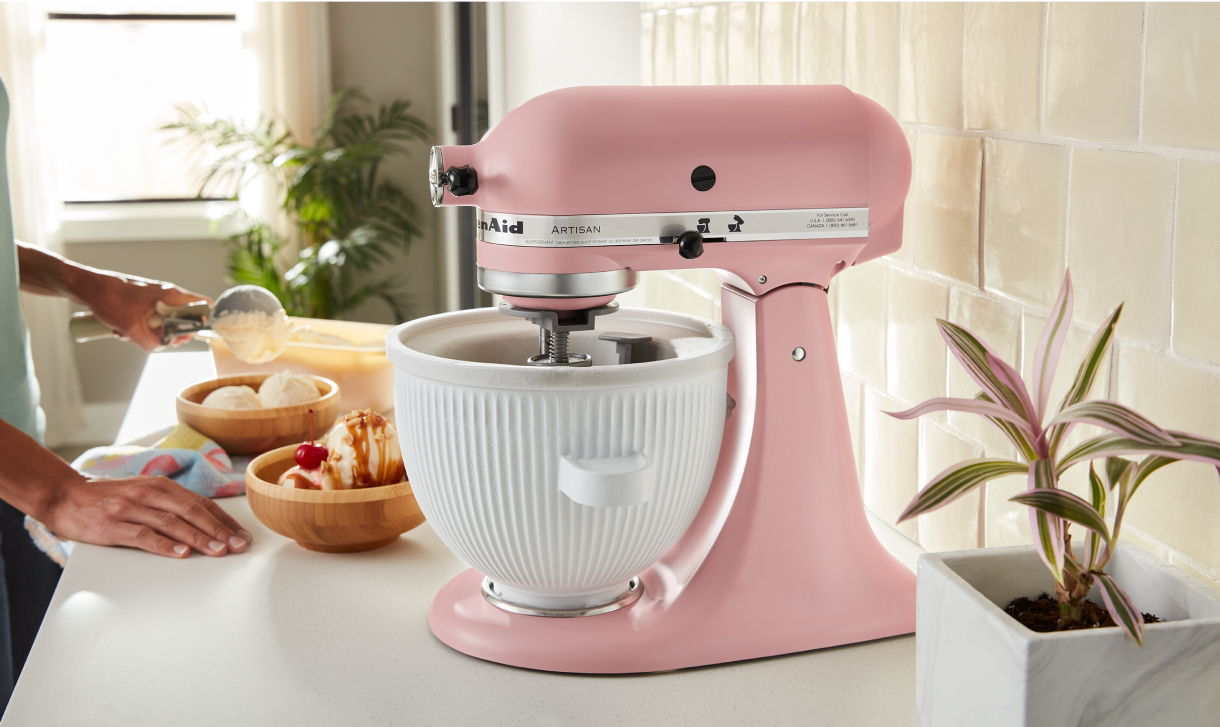 Pink KitchenAid® stand mixer on countertop.