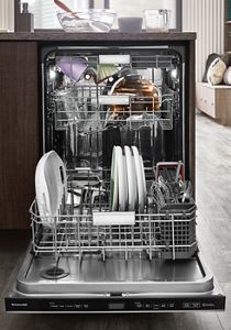 A fully loaded FreeFlex™ Third Rack Dishwasher installed in a bright kitchen.