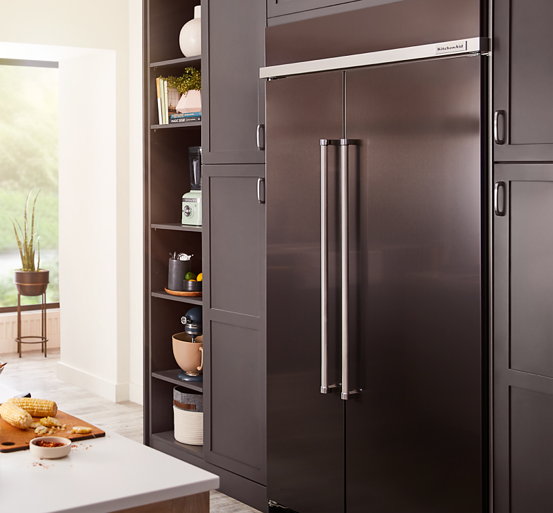 A KitchenAid® black stainless steel refrigerator.