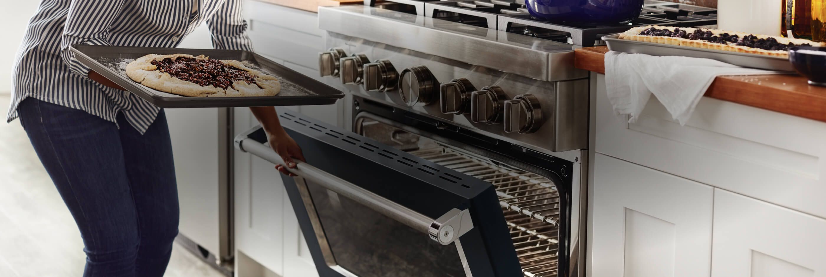 Cooking pizza in a KitchenAid® professional-style range oven.