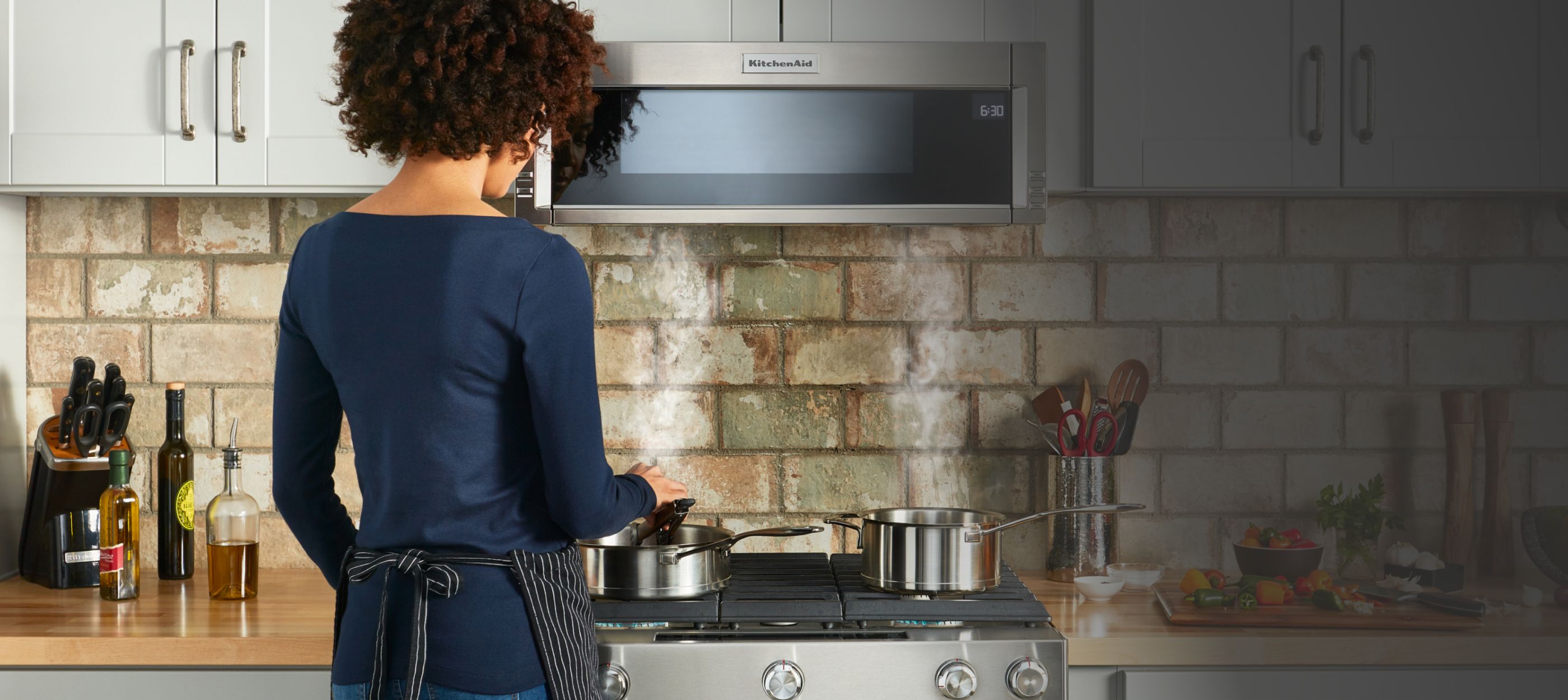 Cooking on a KitchenAid® range.