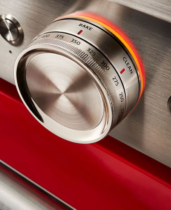 Close-up of passion red range showing temperature dial.