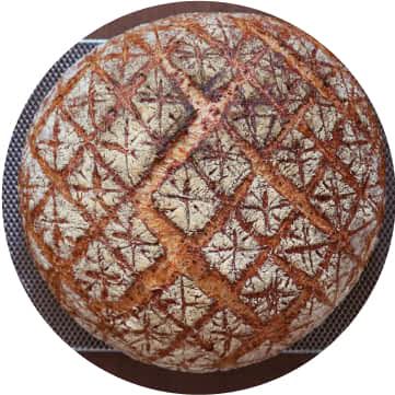 A quilt design on baked bread.