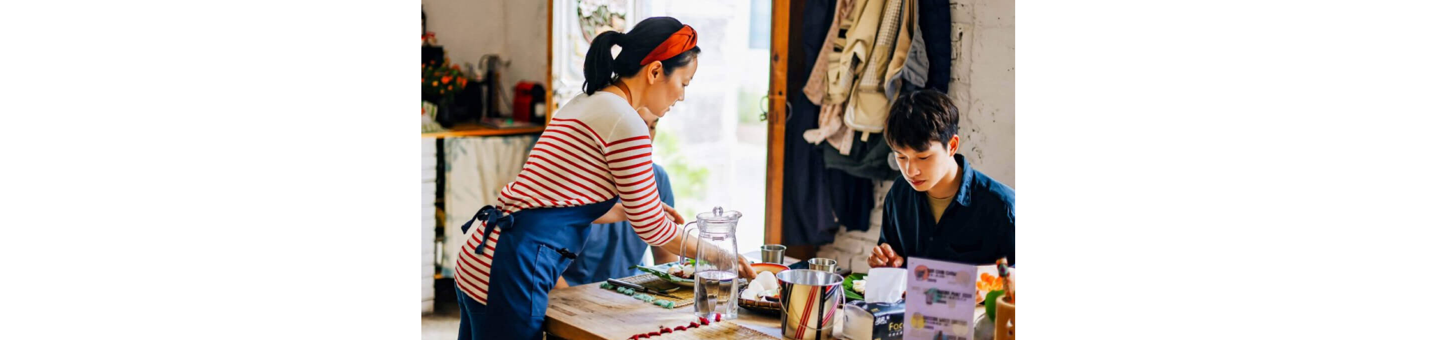 A family sitting at the table.