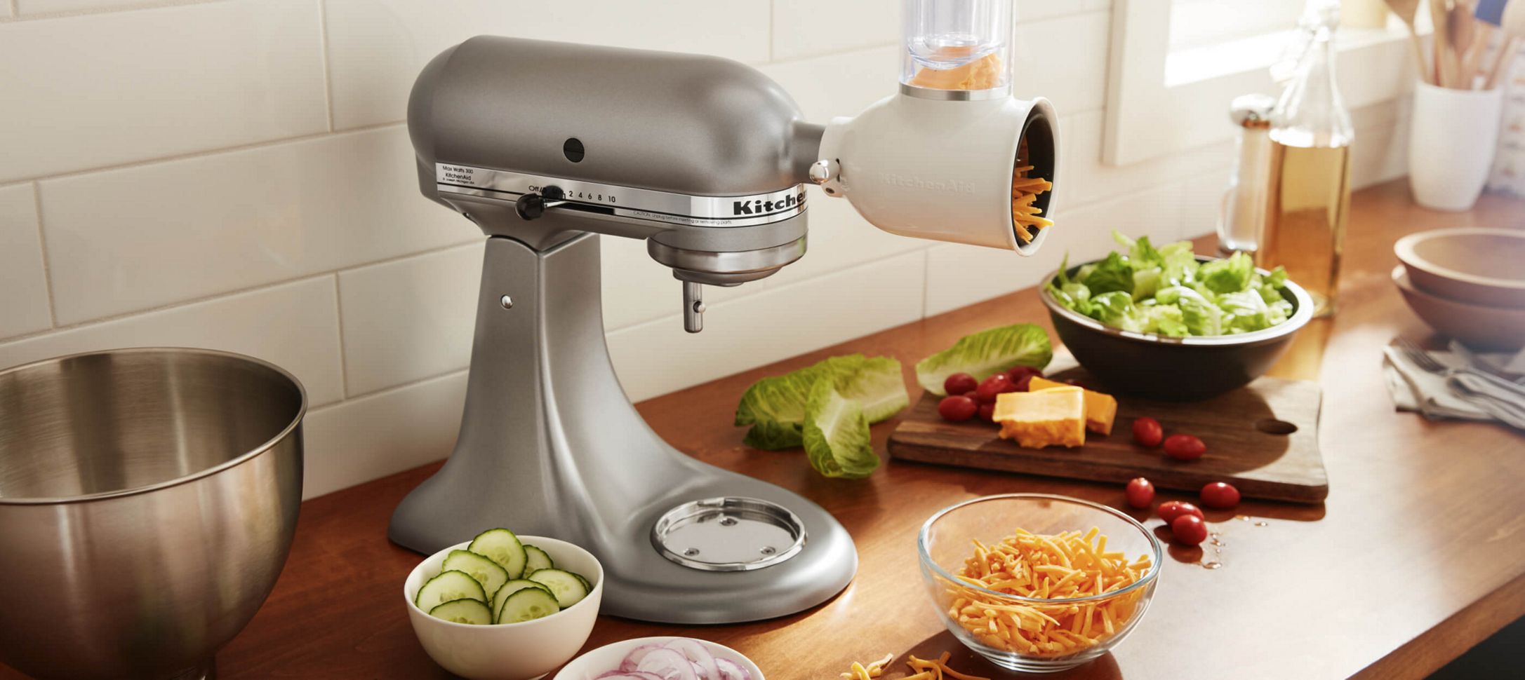 A Stand Mixer with a Shredder Slicer Attachment.