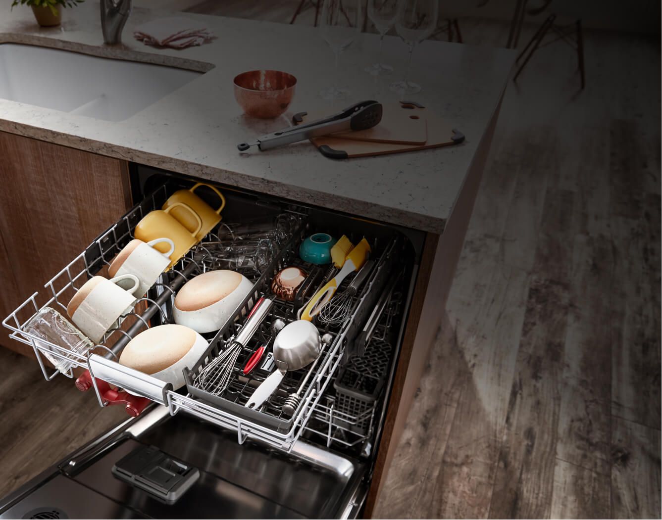 A fully loaded FreeFlex™ Third Rack Dishwasher installed under a bright kitchen counter.