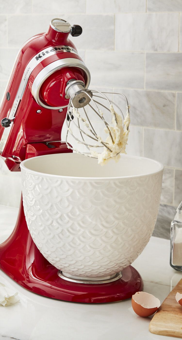 An Artisan® Series 5 Quart Tilt-Head Stand Mixer featuring a 5 Quart White Mermaid Lace Ceramic Bowl.