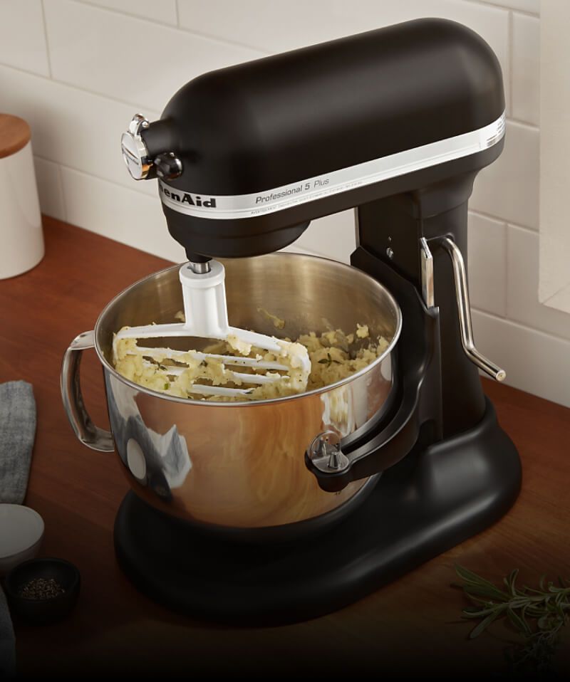 A KitchenAid® stand mixer mixing up dough. 