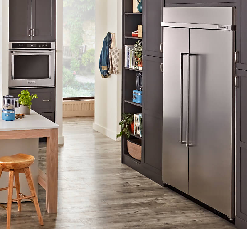 A KitchenAid® Refrigerator in a large contemporary kitchen. 