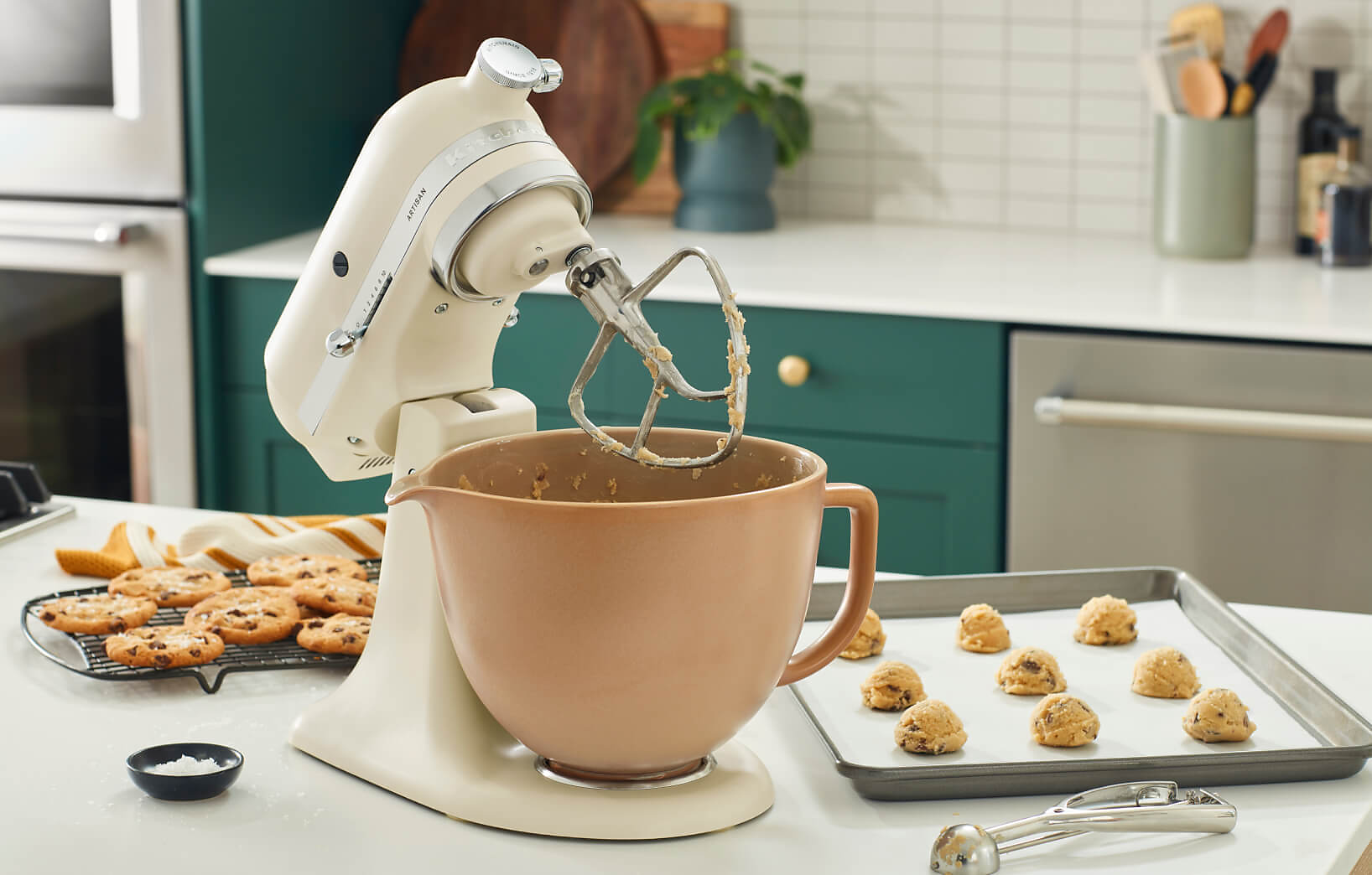 A KitchenAid® Holiday Stand Mixer mixing up cookie dough. 