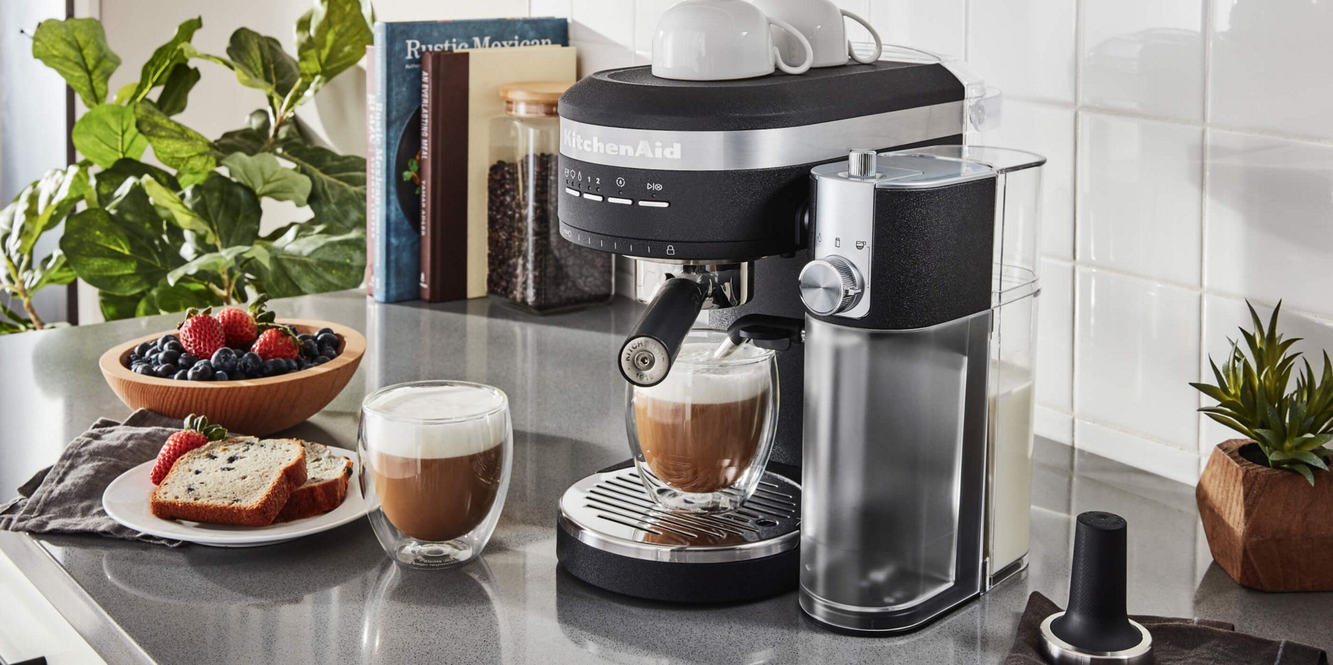 A Matte Black Semi-Automatic Espresso Machine and Automatic Milk Frother.