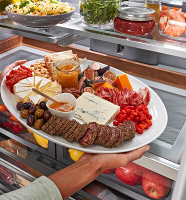 The fully stocked interior of a KitchenAid® Multi-Door Refrigerator.