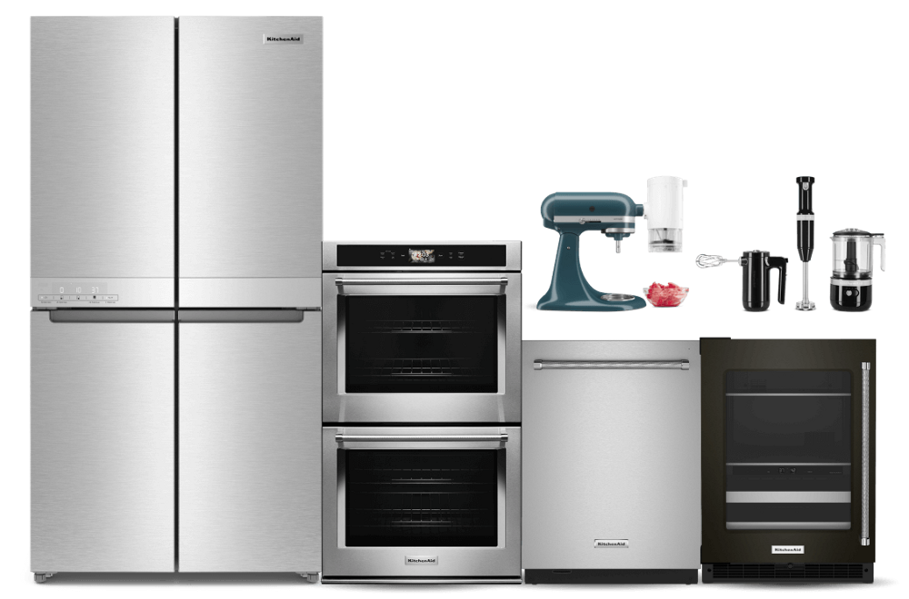 A suite of KitchenAid® appliances, featuring a 4-door refrigerator, double wall oven and various countertop appliances.
