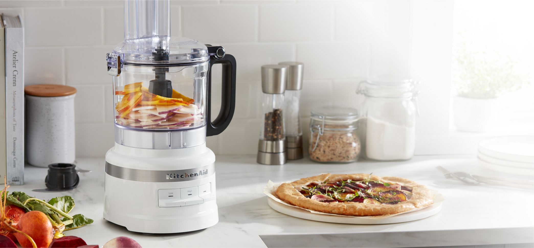 Preparing flatbread with a KitchenAid® food processor.
