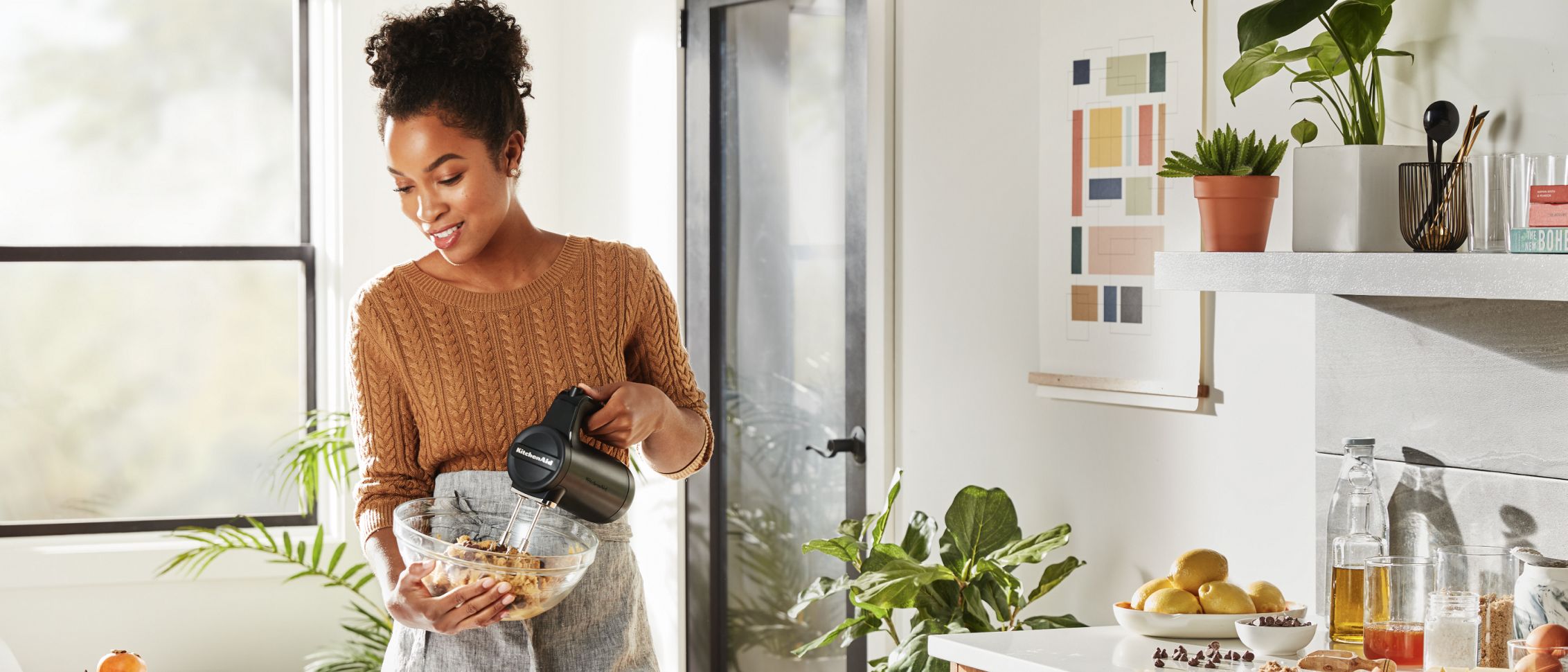 Using a KitchenAid® hand mixer.