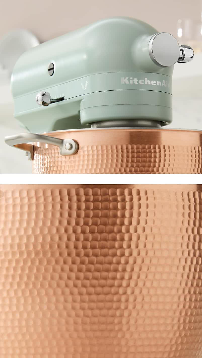 The trim band and hub cover details on the Design Series Stand Mixer. The hammered copper bowl. 