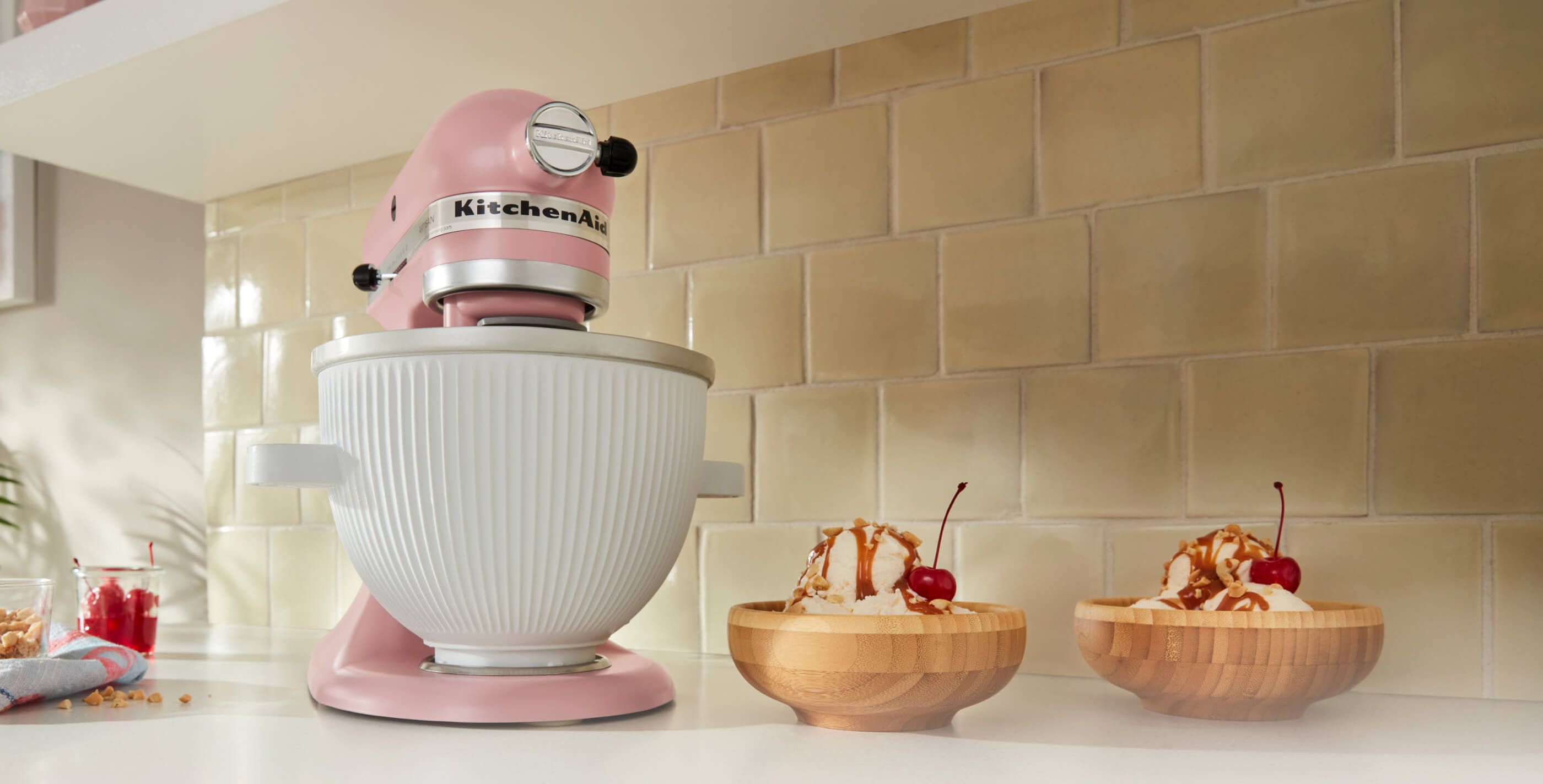 White KitchenAid® Stand Mixer with two small bowls of strawberry ice cream.