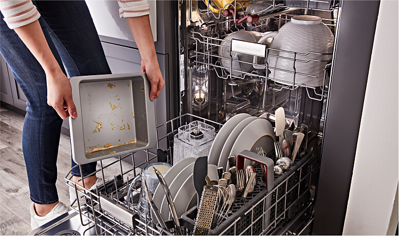 Placing cookware into dishwasher