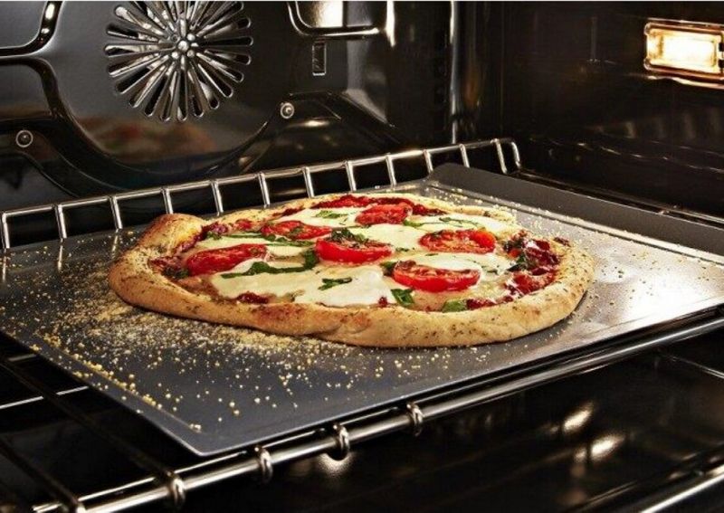 A pizza baking in an oven.