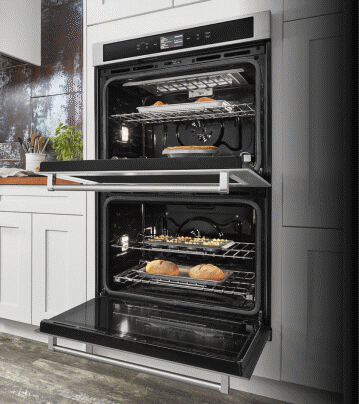 An open Double Wall Oven baking a variety of dishes.