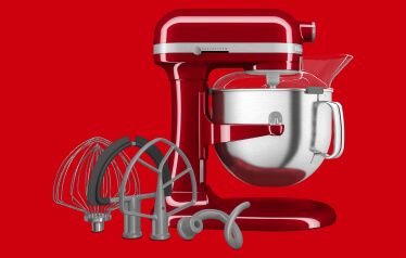 A KitchenAid® Bowl-Lift Stand Mixer in Empire Red with the Premium Accessory Pack.