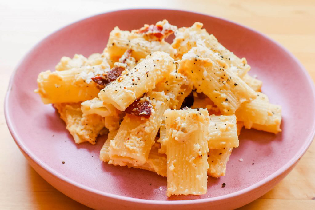 A plate of hearty pasta with parmesan.