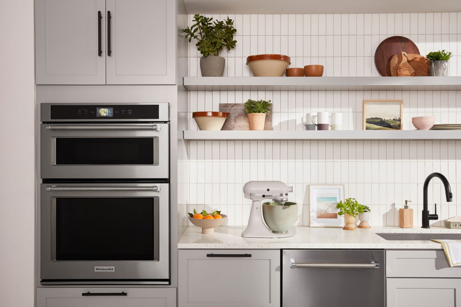 A clean, white kitchen with KitchenAid® appliances.