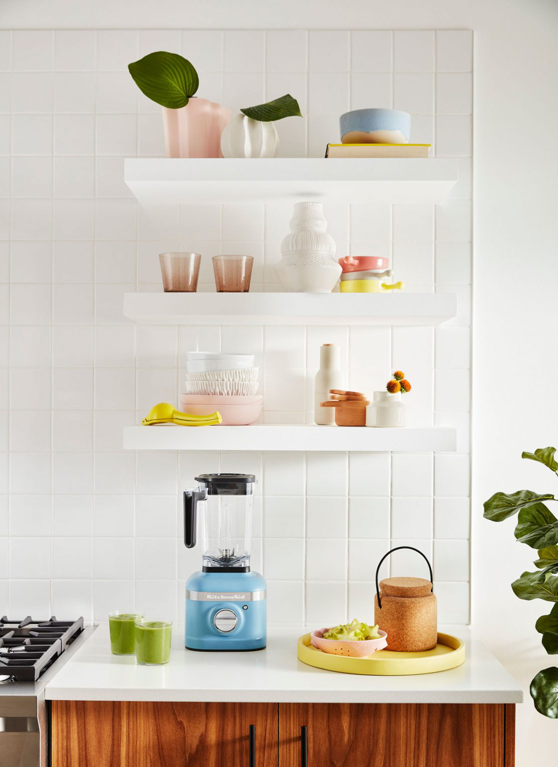 Open shelving with complementary colored dishes.