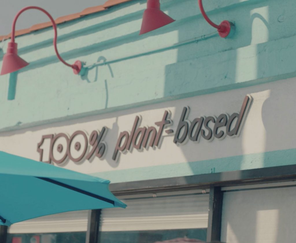 A sign that says 100% plant-based.