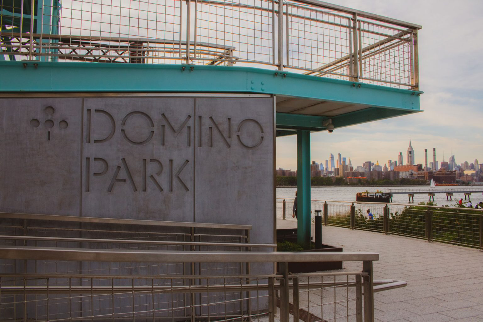 The large, concrete sign of Domino Park.