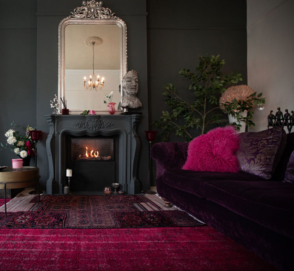 A dark living room with beetroot colors.