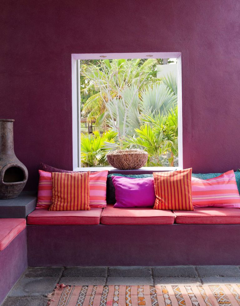 An outdoor living area in featuring beetroot tones.