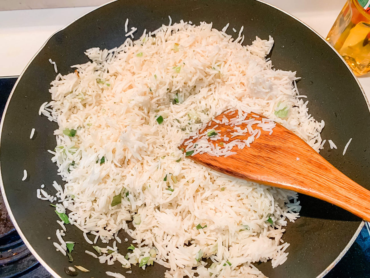 White rice frying in a wok.