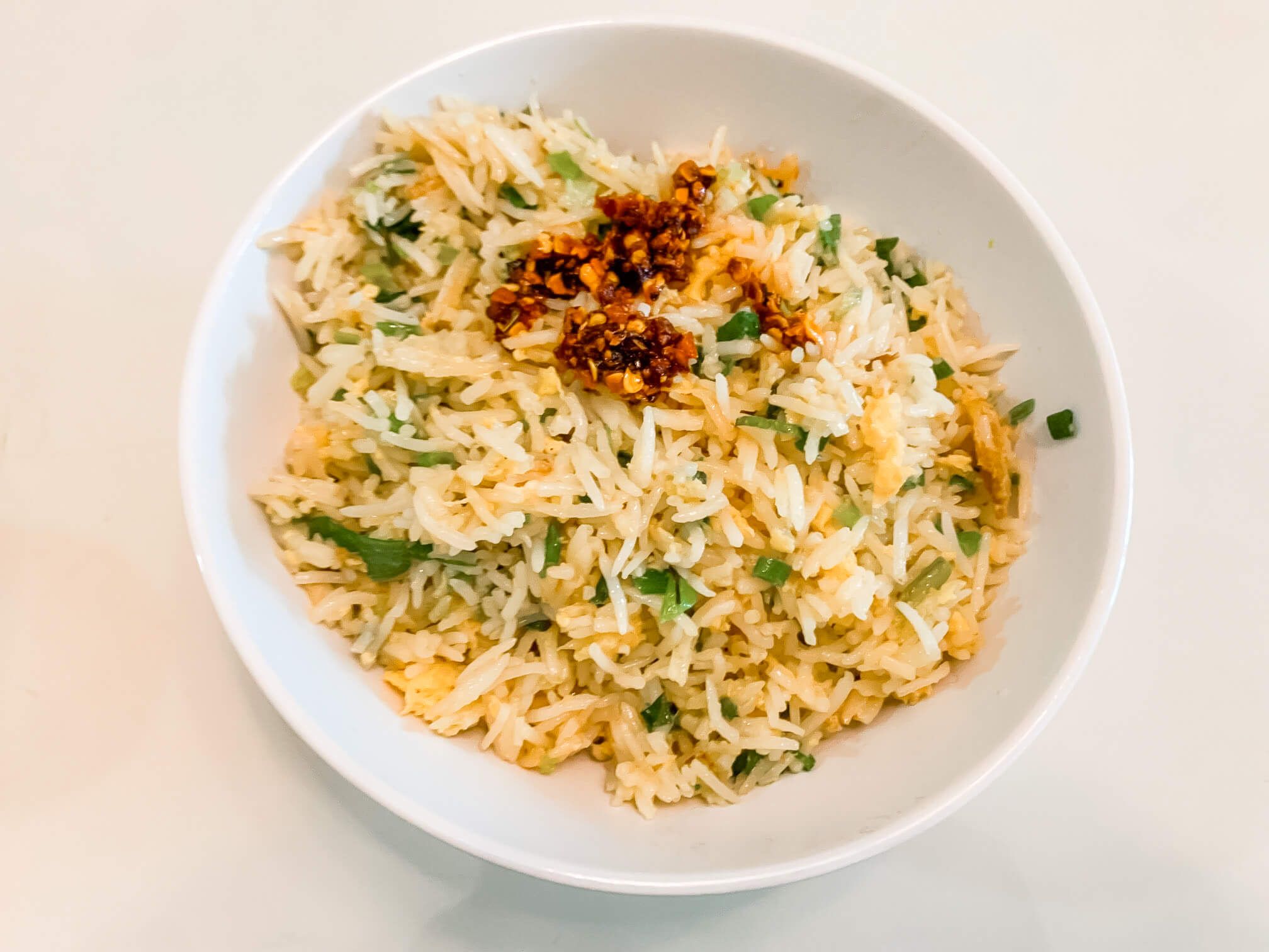 A large bowl of egg fried rice.