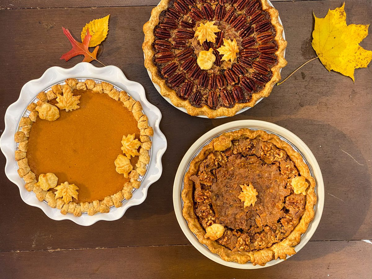 Three fall-themed pies.