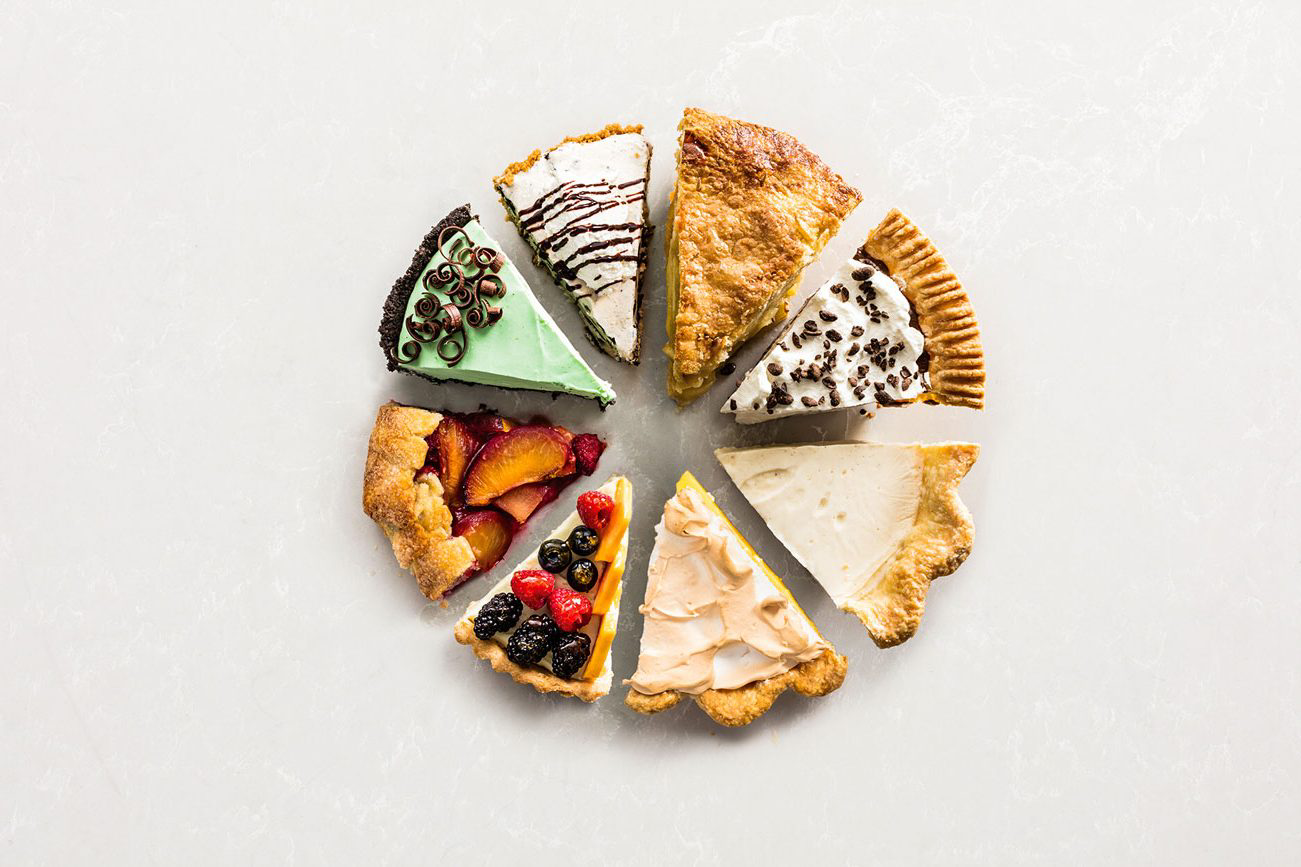 A variety of different slices of pie.