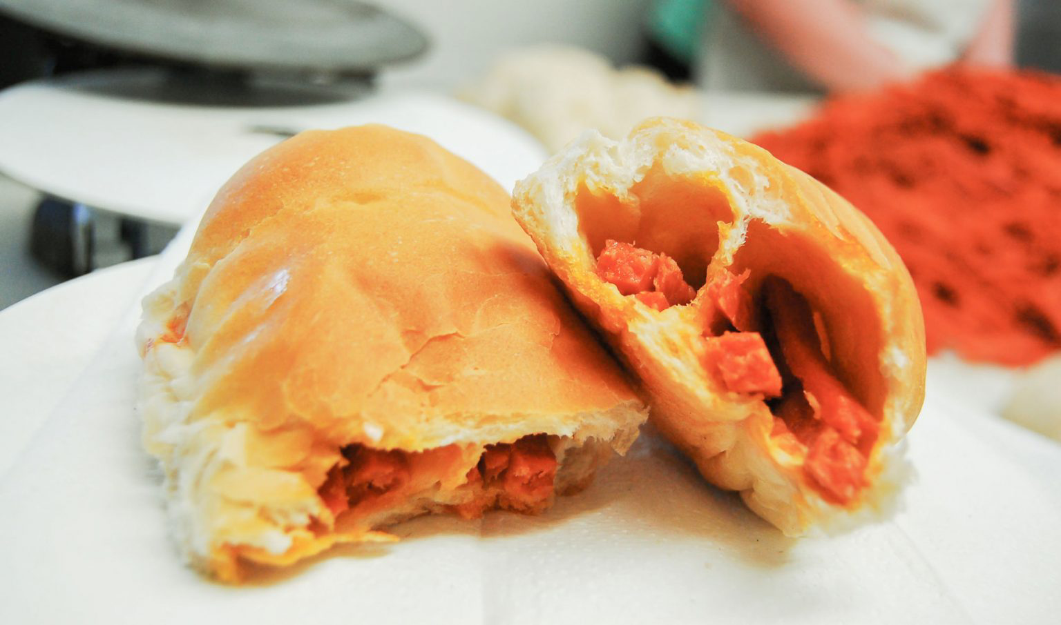 A pepperoni roll ripped in two.