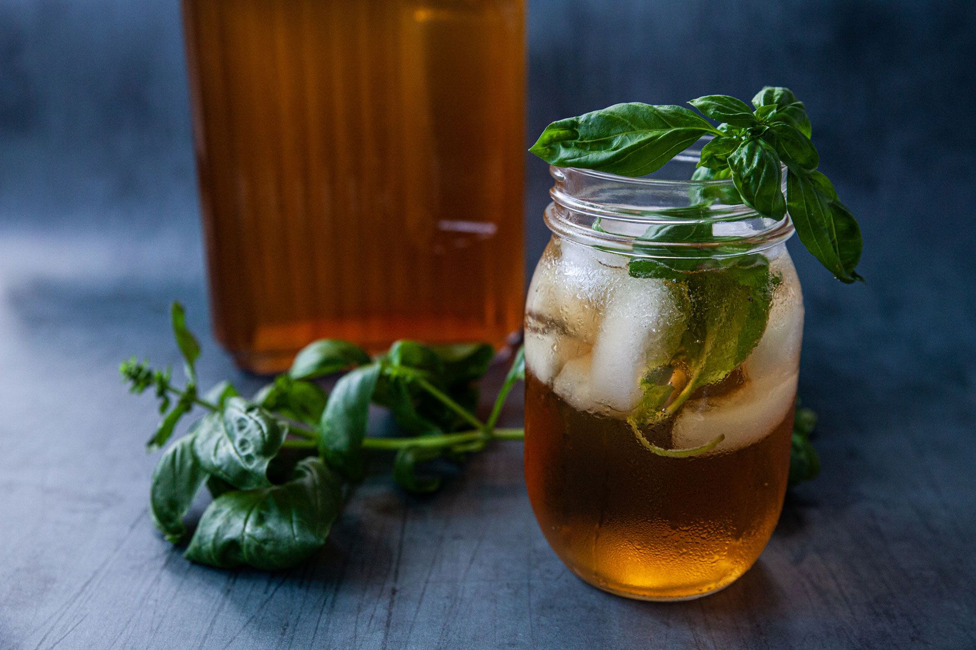 A glass mason jar filled with cold, refreshing iced tea.