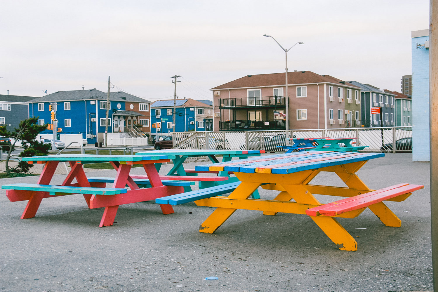 Colorful picnic tables in a park.