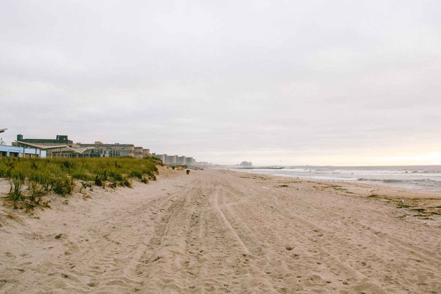 A long strip of sand beach.