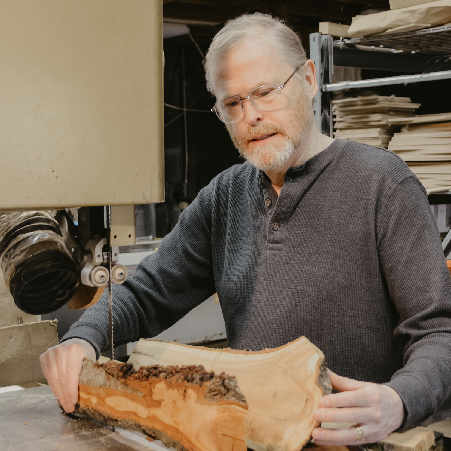 Jonathan Simons holding large pieces of wood.