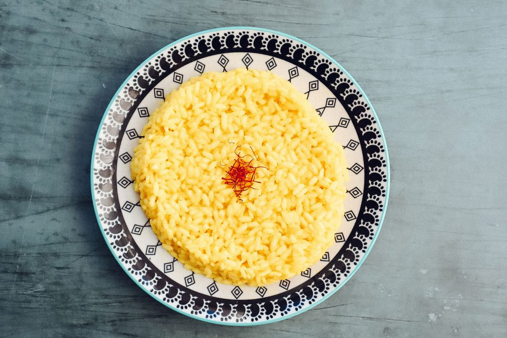 A elaborate dish holding a perfect circle of basmati rice topped with saffron.