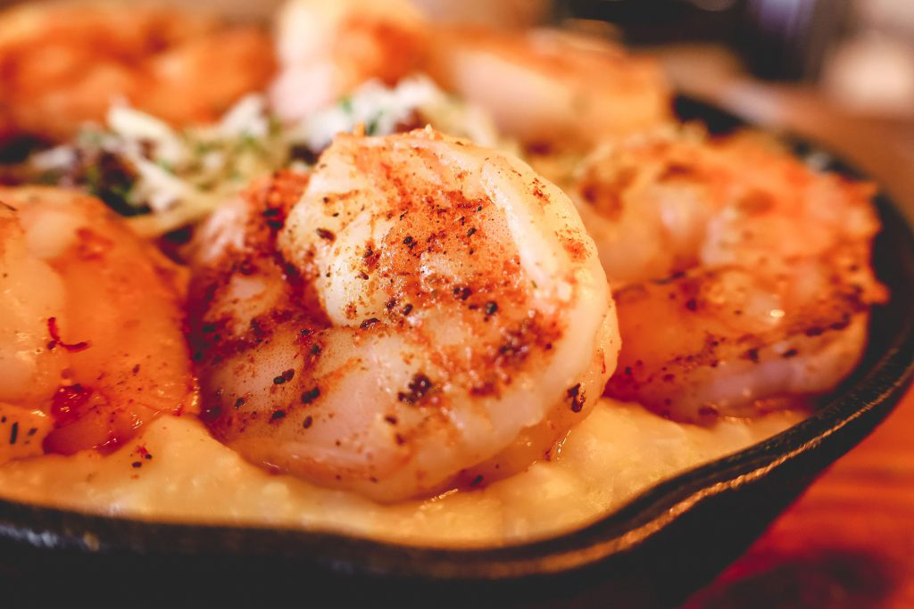 A closeup of a perfectly seasoned shrimp.