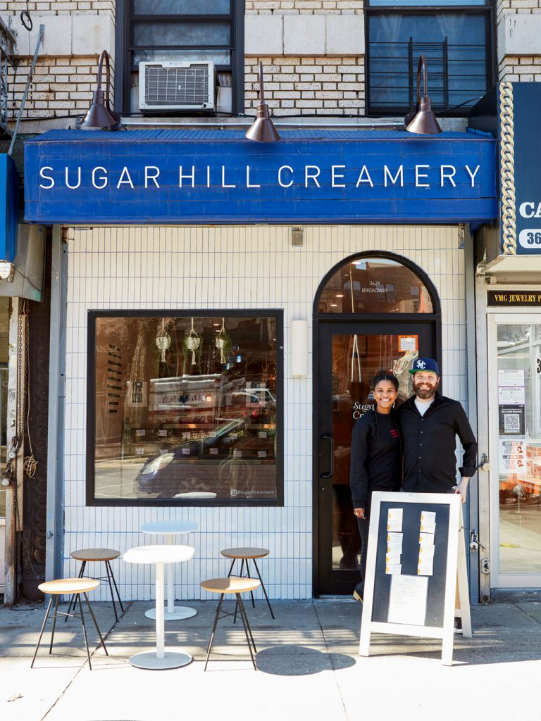 Petrushka and Nick posing for a photo in front of Sugar Hill Creamery.